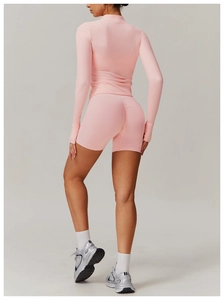 Detail showing high-waist pink fitness shorts with scrunch butt lifting design for women