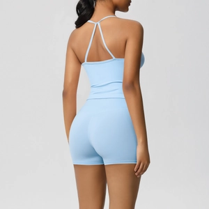 Back view of light blue yoga set featuring cross-back sports bra and high-waist shorts