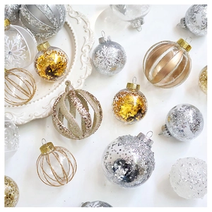Detail of clear Christmas ball ornaments with gold sequins and champagne glitter stripes