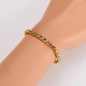 Polished gold stainless steel dragon bone chain necklace displayed on a mannequin