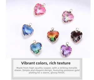 Close-up of heart-shaped colorful zircon charms with gold-plated copper frames