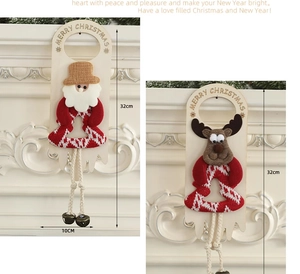 Detail of Christmas Santa and Reindeer door hangers with wooden signs and metal bells