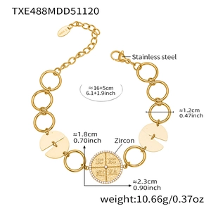 Detail view of a gold stainless steel link bracelet with zircon pendants and measurements