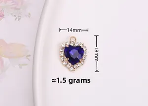 Detailed view of blue heart pendant with dimensions 14mm by 18mm and gold plating