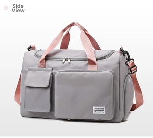 Detail view of the gray nylon fitness bag with separate shoe compartment and pink straps