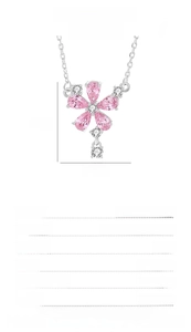 Macro shot of S925 sterling silver peach blossom necklace with pink zircon petals