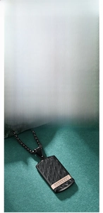 Detail of vintage bark-textured rectangle pendant with inlaid diamonds and beaded chain