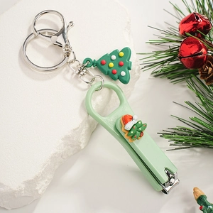 Christmas Santa nail clipper keychain with green festive tree charm and stainless steel rings