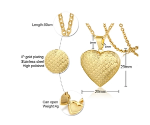Detail of heart locket necklace showing fish-scale texture and internal photo compartment
