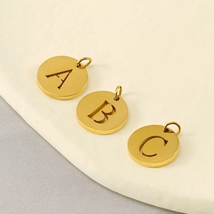 Three gold-plated stainless steel hollow alphabet pendants in A, B, and C styles