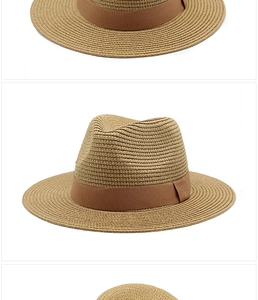 Dettagli dell'intreccio in paglia naturale e del nastro marrone su questo cappello Panama