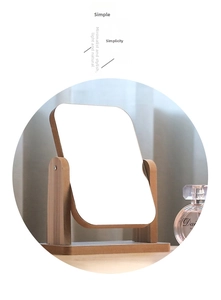 Detail of minimalist wooden makeup mirror featuring rotatable stand and natural grain texture