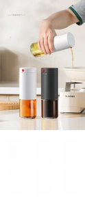 Detail view of leakproof glass oil dispenser with precise control button and sealed lid