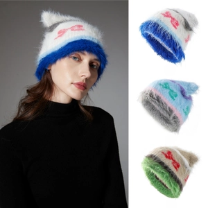 Cute knitted cat ear beanie with bow pattern shown in model and flat lay view