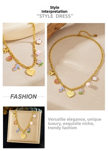 Detail of colorful enamel flower and charms on gold stainless steel necklace