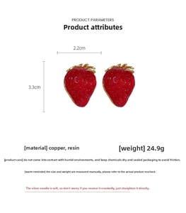 Close-up of strawberry earrings showing 2.2cm width, 3.3cm height and 24.9g weight