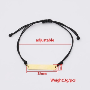 Adjustable hand-woven cord bracelet with a 35mm x 6mm polished gold oval metal bar