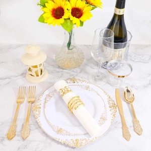Baroque white and gold disposable dinnerware set with cutlery on marble table