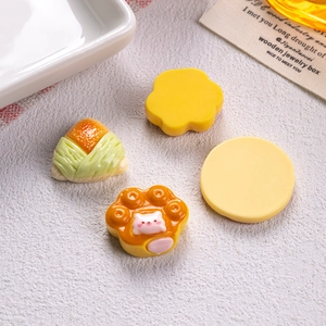 Miniature resin food charms featuring flower, cat paw, and rice ball for DIY crafts