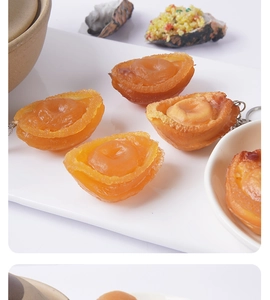 Realistic large abalone food model keychain with detailed texture in a white ceramic dish