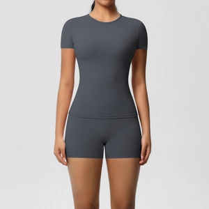 Detail of dark grey high-stretch yoga set featuring a soft brushed finish and tight fit