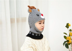 Detail of grey knitted deer hat with 3D reindeer antlers and built-in neck warmer