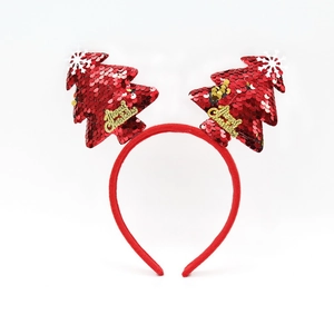 Detail of red sequined Christmas tree headband with white snowflakes and Merry Christmas text