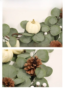 Detailed close-up of white pumpkins, eucalyptus leaves and pine cones on a festive wreath
