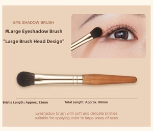 Macro detail of portable large eyeshadow brush with wooden handle and 13mm soft bristles