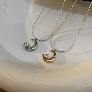 Minimalist moon pendant necklaces in gold and silver finish with crystal on snake chains