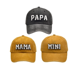Detailed towel embroidery of PAPA, MAMA, and MINI text on washed cotton baseball caps