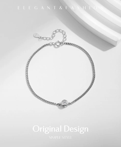 Macro shot of S925 sterling silver chain bracelet with a single round moissanite stone