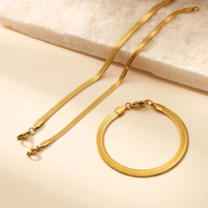 Golden flat herringbone chain necklace and bracelet set in polished stainless steel