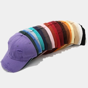 Collection of distressed vintage baseball caps in fifteen assorted colors for a retro look