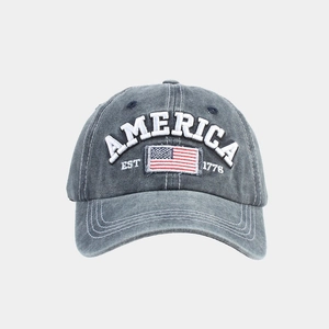 Close-up of washed cotton baseball cap with AMERICA embroidery and US flag patch