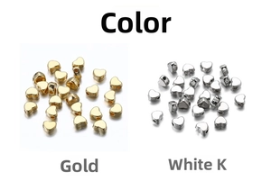 Flat lay of heart-shaped CCB beads in metallic gold and silver finish for DIY jewelry
