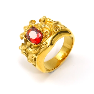 Detailed view of vintage gold-plated crown ring featuring a red oval gemstone