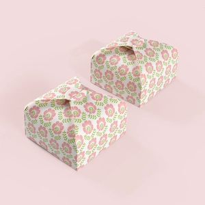 Close-up of square gift boxes with vintage pink floral patterns and folding lids