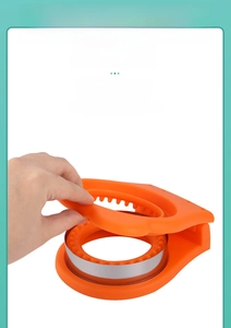 Close-up of the comfortable ergonomic handle of the orange sandwich crust cutter mold