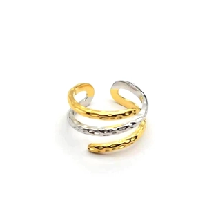 Close-up of a three-layer S925 silver ring with hammered texture and two-tone gold finish