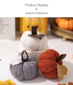Detail showing knitted texture of orange and grey pumpkins with autumn maple leaf accents