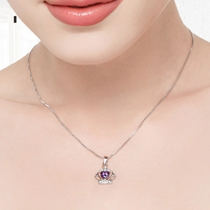 Elegant S925 sterling silver necklace featuring a purple heart crown pendant on a model