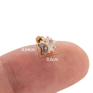 Minimalist gold star and crescent moon piercing stud earrings with clear zircon accents