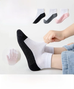 Close-up of breathable mesh cotton socks for children showing high elasticity and rib cuff