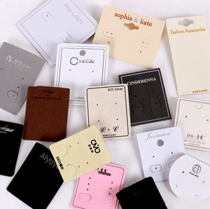 Multiple styles of cardboard earring display cards with S925 needle labels and hanging holes