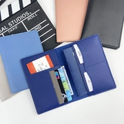 Detail view of leather passport wallet interior with multiple card slots and SIM holder