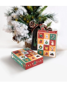 Detailed view of Christmas surprise boxes with festive reindeer and Santa patterns
