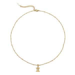Detailed macro view of gold stainless steel Gemini zodiac pendant and beaded chain necklace