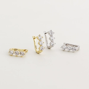 Elegant U-shaped S925 sterling silver earrings with three pavé diamonds in gold and silver