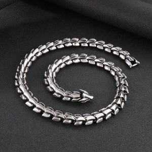 Detailed view of silver stainless steel dragon scale link bracelet with secure clasp